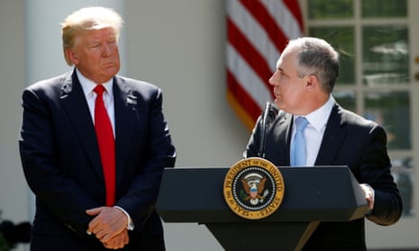 Donald Trump listens to EPA Administrator Scott Pruitt after announcing his decision that the United States will withdraw from the Paris Climate Agreement, in the Rose Garden of the White House in Washington, U.S., June 1, 2017. 
