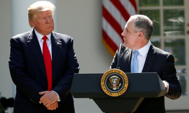 President Trump listens to EPA Administrator Pruitt after announcing decision to withdraw from Paris Climate Agreement in the White House Rose Garden in Washington.