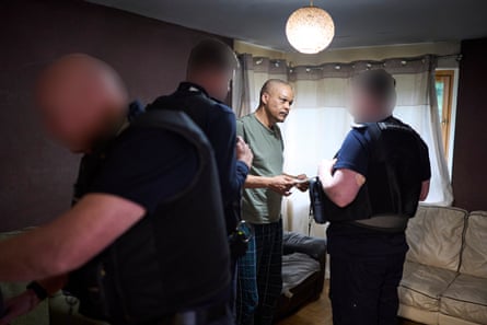 Home Office enforcement officers raiding a flat in Sheffield.