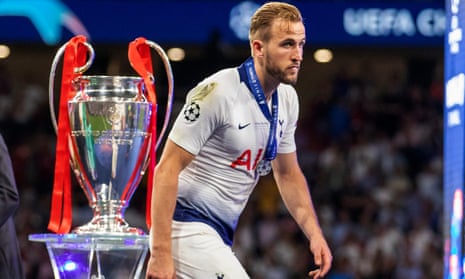 Harry Kane walks past the European Cup after defeat by Liverpool last year, the closest he has come to silverware with Tottenham.
