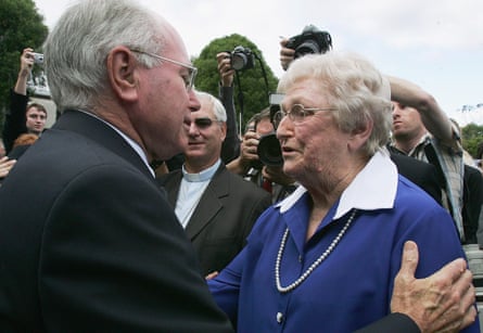 Lady Florence Bjelke-Petersen, right, is greeted by John Howard at the conclusion of the state funeral for her husband, Sir Joh Bjelke-Petersen, in May 2005.