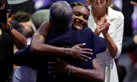 Aaliyah Edwards hugs the UConn head coach Geno Auriemma after being selected sixth overall by the Washington Mystics