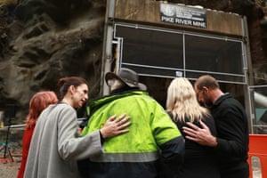 Ardern, second left, consoles family members at a Pike River coalmine in Greymouth, New Zealand, in 2019 after 29 men were trapped and killed in a 2010 explosion