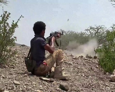 A screengrab from video footage released by the Saudi-backed forces shows a fighter firing at Houthi rebels in Taiz province. A screengrab from video footage released by the Saudi-backed forces shows a fighter firing at Houthi rebels in Taiz province.
