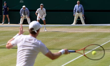 Novak Djokovic awaits a return from Andy Murray during the 2013 Wimbledon final.