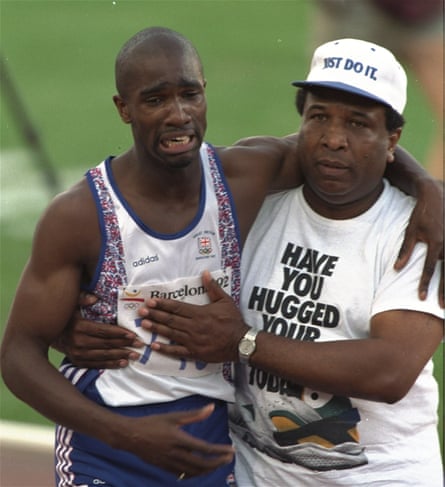 Derek Redmond is helped from the track by his father, Jim.