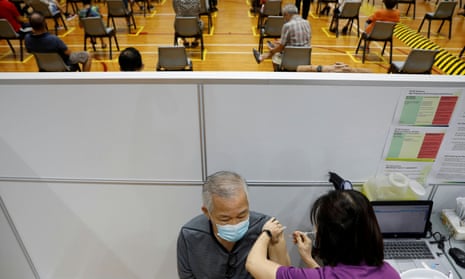 A man receives his vaccination at a coronavirus disease vaccination centre in Singapore.