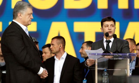 Petro Poroshenko (L) listens to his rival Volodymyr Zelenskiy during a debate in Kiev.