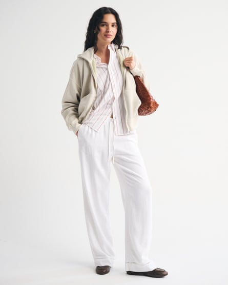 woman wearing white button-down and white linen pants