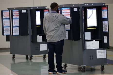 A man casts his ballot at a polling station on 6 December 2022 in Atlanta, Georgia.