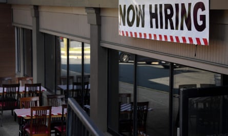 A ‘now hiring’ sign outside a restaurant in Arlington, Virginia.