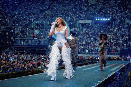 Beyoncé on stage in Versace fringe chaps.