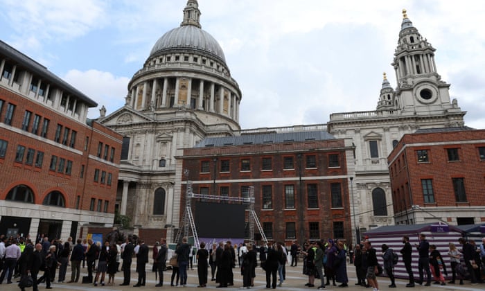 People line up outside St Paul's Cathedral before the memorial service begins.