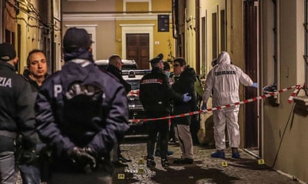 Italian police near the scene where Marcello Bruzzese, brother of a mafioso, was killed in Pesaro
