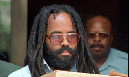Mumia Abu-Jamal, former Black Panther activist and journalist convicted of killing Philadelphia police officer Daniel Faulkner in 1981, leaves a Philadelphia court 12 July 1995.