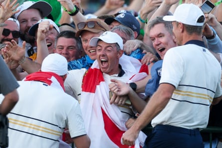 Rory McIlroy celebrates with fans after Europe’s victory at Bethpage.