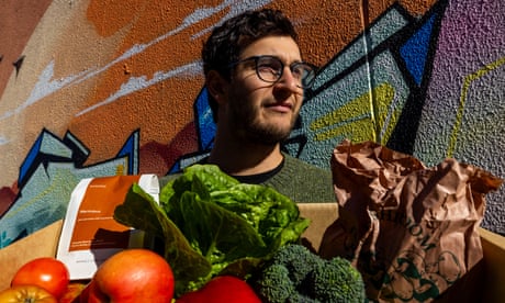 Josh Brooks-Duncan, co-founder of imperfect box delivery company Farmers Pick, carries a box ready for delivery to a customer in Brunswick, Melbourne.