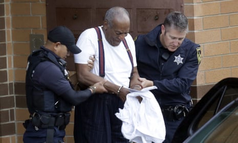 Bill Cosby is escorted out of the Montgomery County Correctional Facility on Tuesday following his sentencing