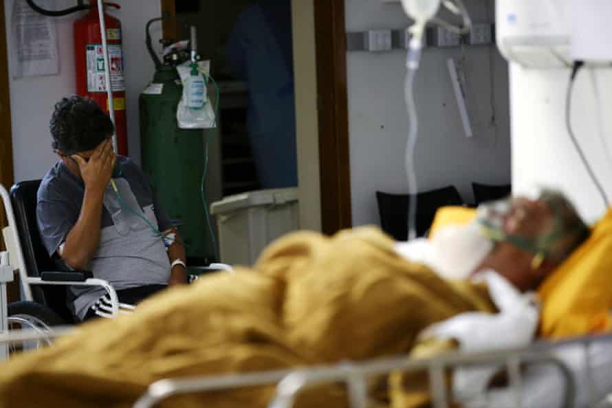 Patients in the emergency room of a hospital that is overcrowding in Porto Alegre, Brazil, on 11 March.