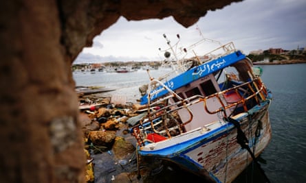 A discarded vessel on a beach in Lampedusa.