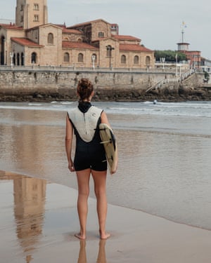 Surfing in Gijón.