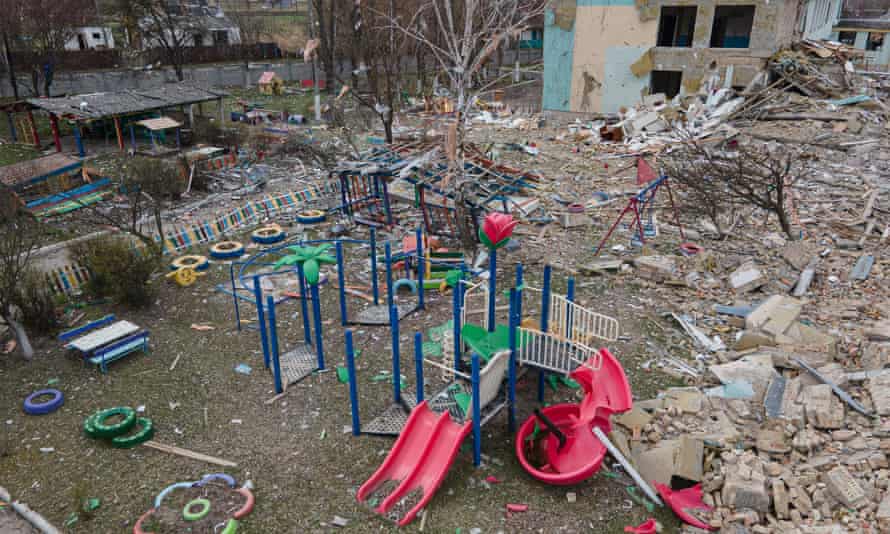 In this aerial view, a damaged playground is seen next to the Barvinok kindergarten building that was bombed during the Russian invasion west of Kyiv.