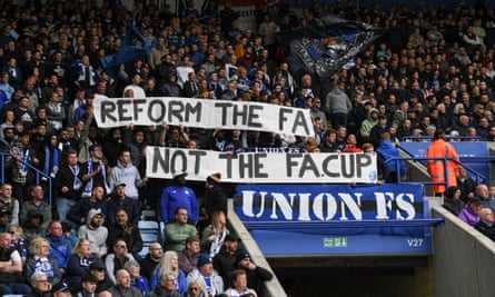 Leicester fans hold up a banner reading “Reform the FA, not the FA Cup”, protesting against the FA’s decision to abolish FA Cup replays