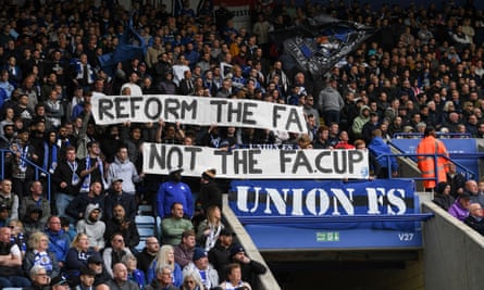 Leicester fans hold up a banner reading “Reform the FA, not the FA Cup”, protesting against the FA’s decision to abolish FA Cup replays
