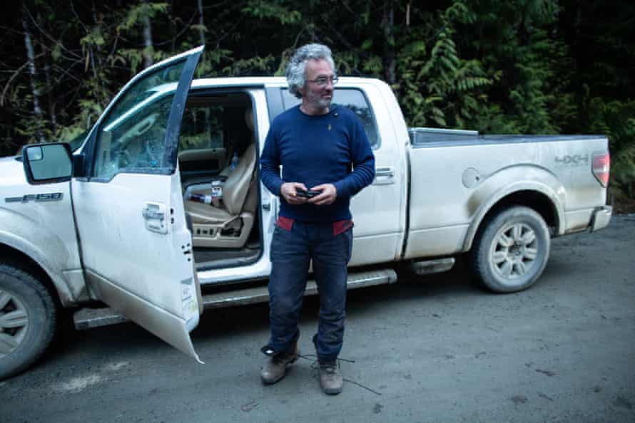 Trevor Simpson makes a satellite phone call after being refused access to a cut block by members of the Rainforest Flying Squad.