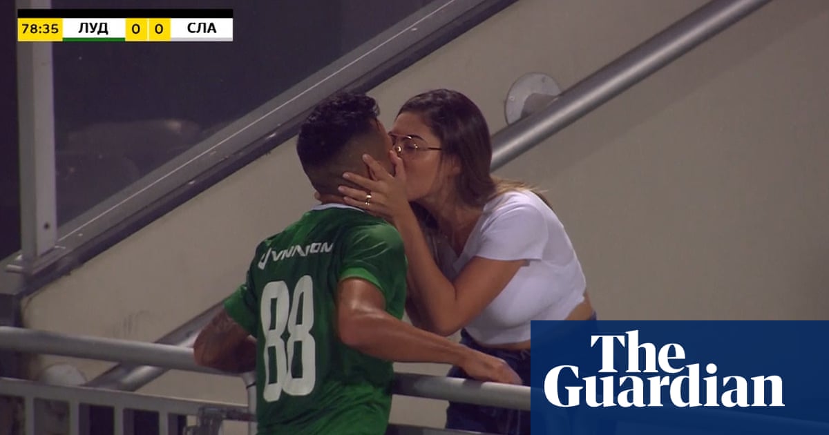 Footballer rushes to kiss wife in celebration … as goal is disallowed – video