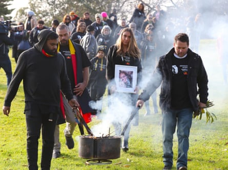 Tanya Day’s family members, including Apryl Day (centre), march to the coroner’s court in August 2019 after a smoking ceremony.
