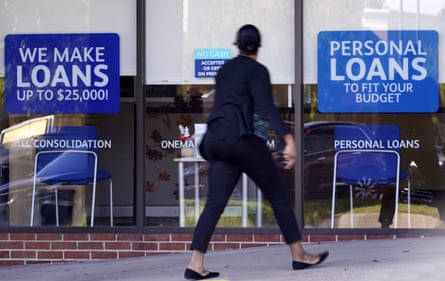 A woman walks past a personal finance loan office on 1 October in Franklin, Tennessee.