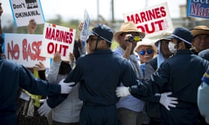 People stage a rally in Okinawa over American military presence in Japan.
