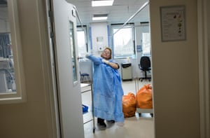 A cleaner prepares to clear and disinfect a bay