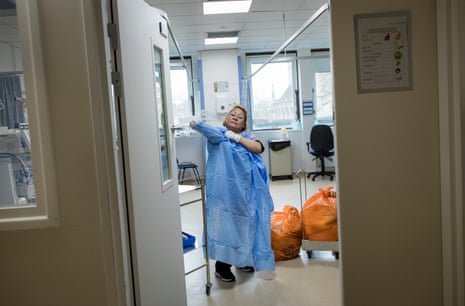 A cleaner prepares to clear and disinfect a bay