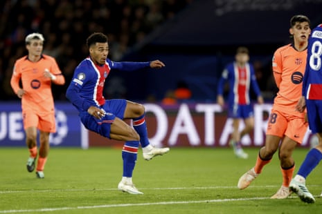 Desiré Doué kicks the ball mid-air, scoring for PSG against Barcelona