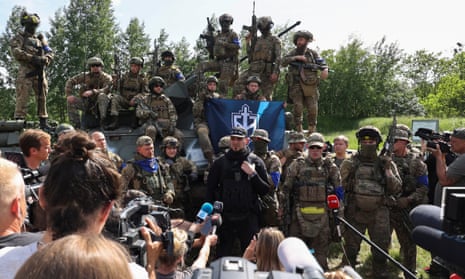 Members of the Russian Volunteer Corps and Freedom of Russia Legion hold a meeting with the media near the Russian border in the Kharkiv region of Ukraine.