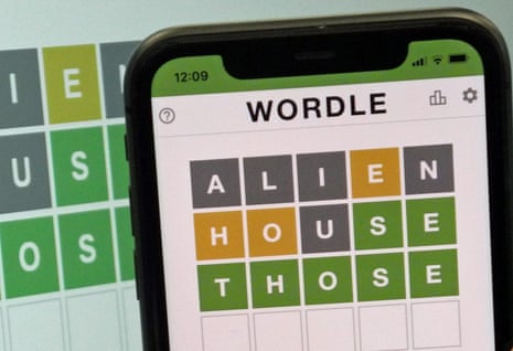 A photograph showing a mobile phone with the Wordle app open