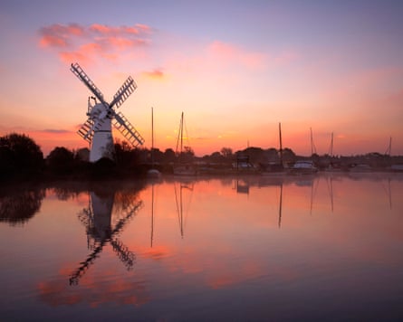 Sunrise over a windmill on the Norfolk Broads