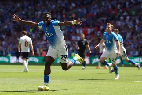 Sidibeh celebrates.