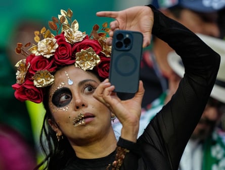 A Mexico fan prepares for their match against Czechia.