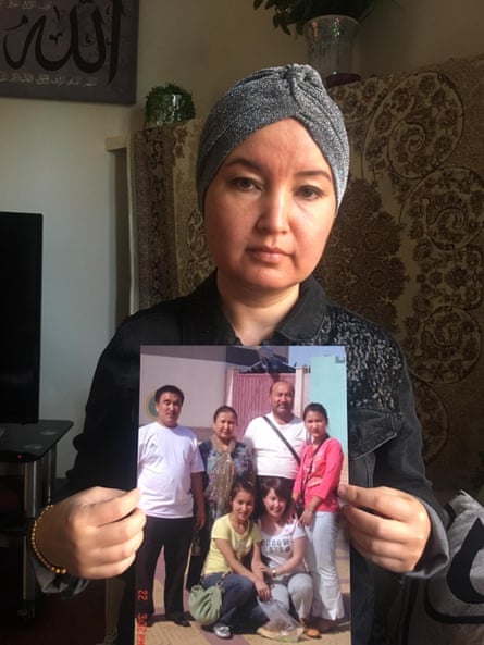 Fatimah Abdulghafur, a Uighur woman based in Sydney, Australia. Shows a picture of family members who have disappeared in Xinjiang. July 2019