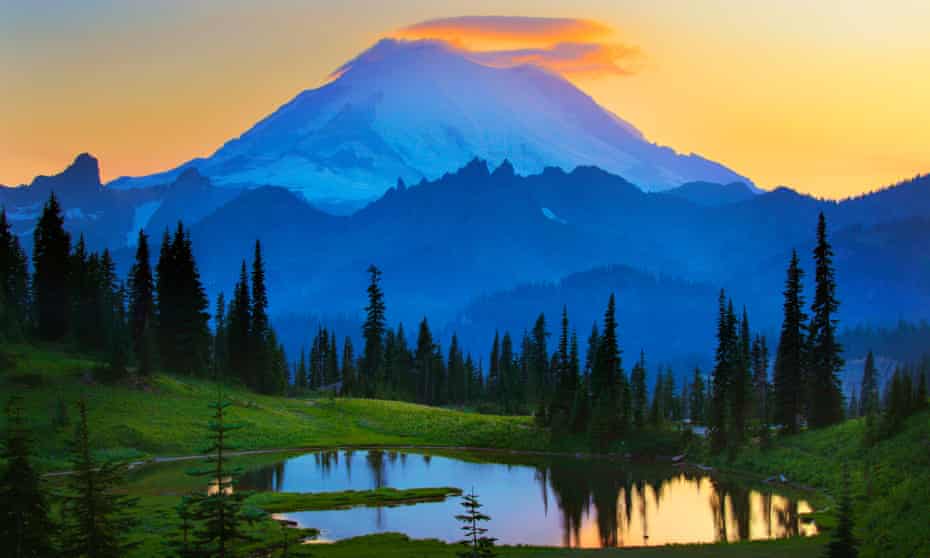 Mount Rainier at sunset. Opponents of the plan for cellular service see it as an unwelcome desecration of nature.
