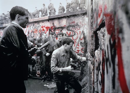 West Germans demolish the Berlin Wall in 1989.