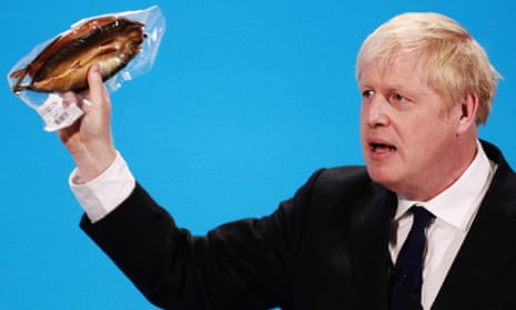 Boris Johnson holds a kipper to help illustrate a point as he talks at the final hustings of the Conservative leadership campaign