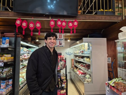 Young man smiling in Chinese supermarket