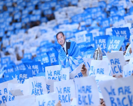 Coventry fans hold up a cardboard cutout of Frank Lampard with placards that read ‘We Are Back’ before the Championship match against Wrexham