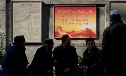 A political poster promotes ‘socialist values’ between lists of religious regulations at Xiaopiyuan Street Mosque in Xi’an’s Muslim quarter.