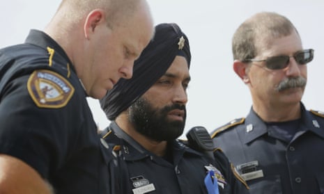 Sandeep Singh Dhaliwal, center, a Harris county sheriff’s deputy, was known as a trailblazer for being one of the first to wear a turban and beard as part of his uniform. 