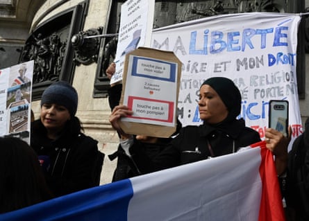Muslim women protest in Paris in October 2019 for the right to continue wearing headscarves.